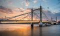 Albert Bridge and beautiful sunset over the Thames, London England UK