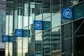 Albert Heijn supermarket logo at Utrecht Central Station Utrecht, 4 vertical icon logoâs reflecting in the window.