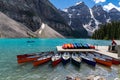 Canoes at the boathouse on Morinae Lake in the summer in the Canadian Rockies Royalty Free Stock Photo