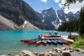 Canoes at the boathouse on Morinae Lake in the summer in the Canadian Rockies Royalty Free Stock Photo