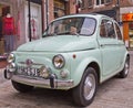 Albi, France - February, 23, 2013: old retro vintage old timer light green car Fiat 500 parked in street town Royalty Free Stock Photo