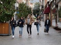 Five Girls Walk Through Town While Shopping In The Cold