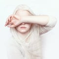 Albino girl with white pure skin, natural lips and white hair. Photo face on a light background. Portrait of the head. Blonde girl Royalty Free Stock Photo