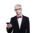 Albino young man in suit with mobile isolated.