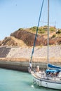 Private sailboat leaving for a cruise from the bay of Marina de Albufeira Royalty Free Stock Photo