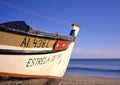 Colorful wooden Fishing Boat on the beach at sunset Royalty Free Stock Photo