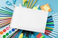 An album for drawing and creativity for school with stationery, a palette of colored paints, markers, brushes and Royalty Free Stock Photo