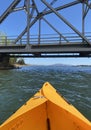 Tucktec folding kayak boat in orange colour on lake Hume near a bridge, is an impressive body of water