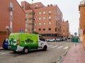 ALCALA DE HENARES, SPAIN; JANUARY 2, 2022: ELECTRIC HOME DELIVERY VAN, LEAVING A PARKING LOT ON THE STREET Royalty Free Stock Photo