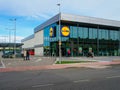 ALCALA DE HENARES, SPAIN; JANUARY 2, 2022: LIDL BRAND SUPERMARKET WITH A PARKING LOT IN FRONT OF IT