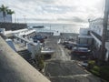 Alcala, Tenerife, Canary islands, Spain, december 20, 2021: Cocrete pier with docked fishing boats, harbor in small