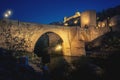 Alcantara Bridge and Alcazar of Toledo at night - Toledo, Spain Royalty Free Stock Photo