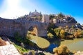 Alcantara bridge in Toledo with Alcazar on the background. Toledo, Castilla - La Mancha, Spain. Royalty Free Stock Photo