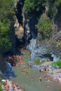 ALCANTARA, ITALY - AUGUST, 2015: People enjoy ice-cold water of Alcantara river in the Alcantara river park in August, 2015 in Sic