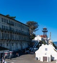 Alcatraz island`s boat ship dock with the barracks or apartments and guard tower from the front or center part of the island