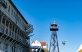 Alcatraz island`s boat ship dock with the barracks or appartments and guard tower from the front or center part of the island