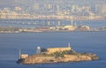 Alcatraz Island in San Francisco Bay with Bay Bridge and Oakland in background