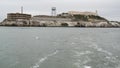 Alcatraz island in San Francisco Bay, California USA. Federal prison for gangsters on rock, foggy weather. Historic jail, cliff in Royalty Free Stock Photo