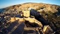 Defense Walls of Ancient fortress Alcazaba of Almeria, Spain - aerial shot including panoramic view of the Almeria city Royalty Free Stock Photo