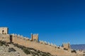 Alcazaba wall on a hill in an arid land in Almeria Spain Royalty Free Stock Photo