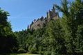 Alcazar Castle Seen From The River That Runs Through The Valley That Reigns In Segovia Slightly Caught By A Small Grove. Architect Royalty Free Stock Photo