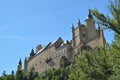 Alcazar Castle Seen From The River That Runs Through The Valley That Reigns In Segovia Slightly Caught By A Small Grove. Architect Royalty Free Stock Photo