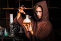 Alchemist in chemical laboratory prepares magical liquids Royalty Free Stock Photo