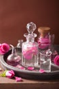 Alchemy aromatherapy with rose flowers flasks