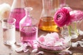 Alchemy and aromatherapy set with ranunculus flowers and flasks Royalty Free Stock Photo