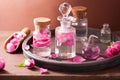 Alchemy and aromatherapy set with rose flowers and flasks