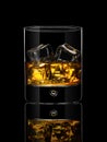 Glass of whiskey on a black background Royalty Free Stock Photo