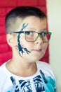 Alchevsk, Ukraine - August 3, 2017: A child draws a face for a children`s party. Aqua makeup for girls and boys.