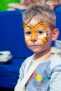 Alchevsk, Ukraine - August 3, 2017: A child draws a face for a children`s party. Aqua makeup for girls and boys.