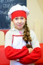 Alchevsk, Ukraine - January 21, 2018: child in the shape of a chef posing