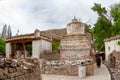 Pilgrim in the courtyard of the ancient Buddhist monastery Alchi in Ladakh on the Tibetan plateau