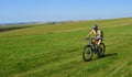 Female Mountain biker riding the South Downs near Bo Peep Hill East Sussex.