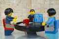 Alcobendas, Spain - May 14, 2018: Working team, working together around a round table. LEGO minifigures concept, Lego minifigures