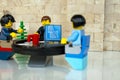 Alcobendas, Spain - May 14, 2018: Working team, working together around a round table. LEGO minifigures concept, Lego minifigures