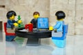 Alcobendas, Spain - May 14, 2018: Working team, working together around a round table. LEGO minifigures concept, Lego minifigures