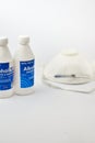 Alcohol bottle with n95 mask for prevention from corona virus on white background