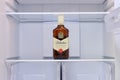 Alcohol bottles whiskey Ballantines in empty refrigerator - Moscow, Russia, January 06, 2021