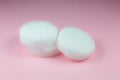 Alcohol burner pills on pink background. Dry alcohol dry fuel for flame. Close up