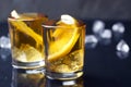 Alcohol cocktail with brandy, whiskey, lemon and ice in small glasses Royalty Free Stock Photo