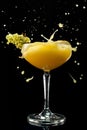 Daiquiri with mango. Mango margarita frappe with splash on black background. Copy Space Royalty Free Stock Photo