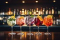 Alcohol cocktail drink on the bar counter in the pub or nightclub, Five colorful gin tonic cocktails in wine glasses on the bar Royalty Free Stock Photo