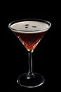 Alcohol cocktail Espresso Martini cocktails garnished with coffee beans on black background. Royalty Free Stock Photo