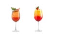 Alcohol cocktail with mint, fruit and berries on a white background. A set of two cocktails in glass goblets on a long leg Royalty Free Stock Photo