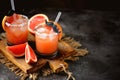 Alcohol cocktail `Salty dog` with vodka, grapefruit fresh, sea salt and ice. Royalty Free Stock Photo