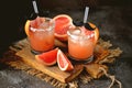 Alcohol cocktail `Salty dog` with vodka, grapefruit fresh, sea salt and ice. Royalty Free Stock Photo