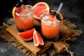 Alcohol cocktail `Salty dog` with vodka, grapefruit fresh, sea salt and ice. Royalty Free Stock Photo